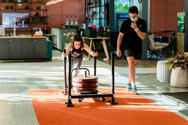 Woman working out with her trainer